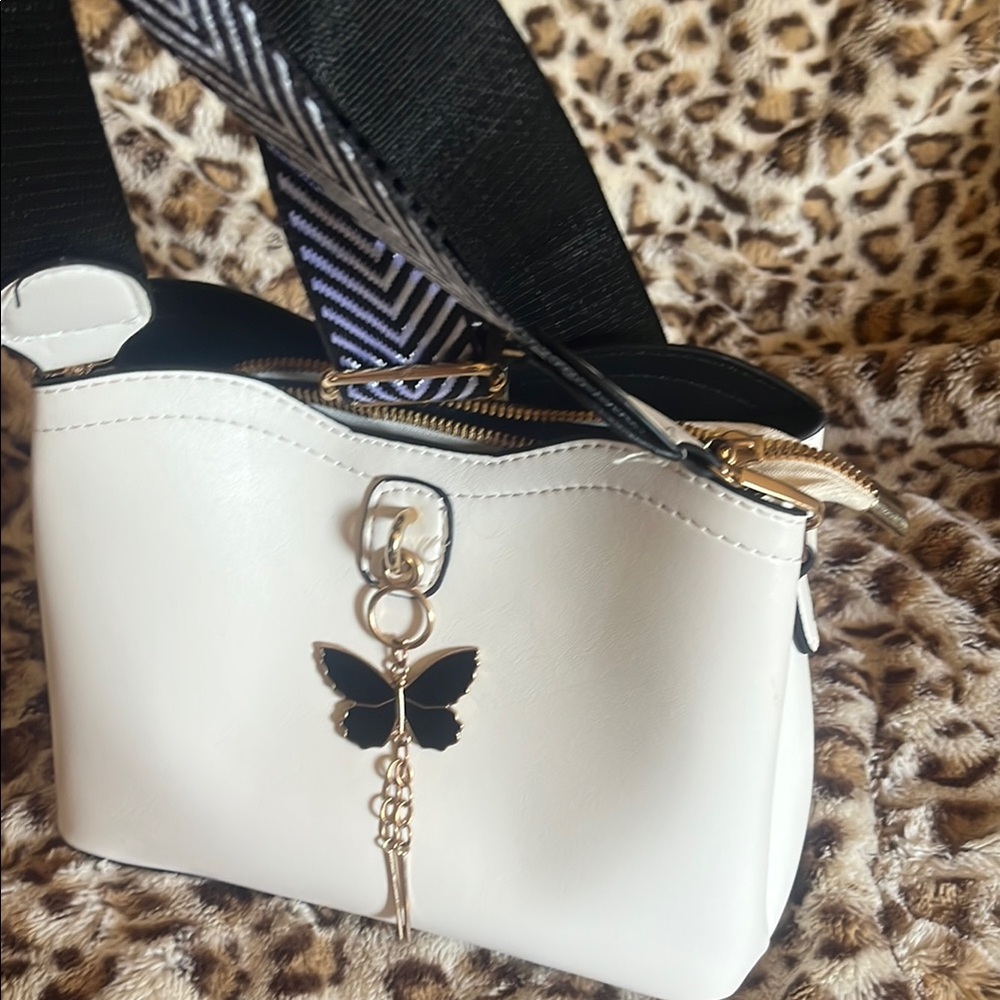 Stylish White Handbag with Black Butterfly Charm